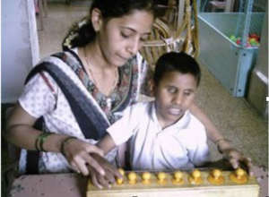 Visually Impaired Child Being Taught by a Teacher
